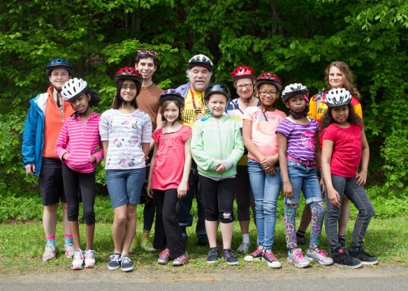 Volunteers from Elm City Cycling with girls from the Farnham Neighborhood House